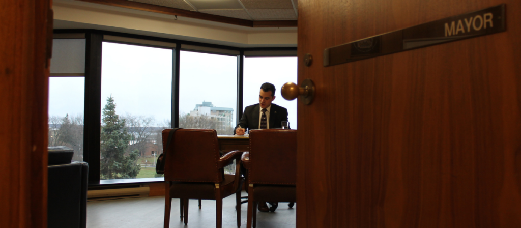 Mayor Matthew Shoemaker sits at his desk in the office of the Mayor