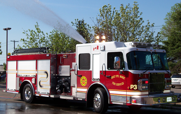 A firetruck spraying water in a training exercise