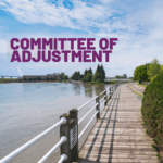 Boardwalk view of St. Mary's River with Committee of adjustment across