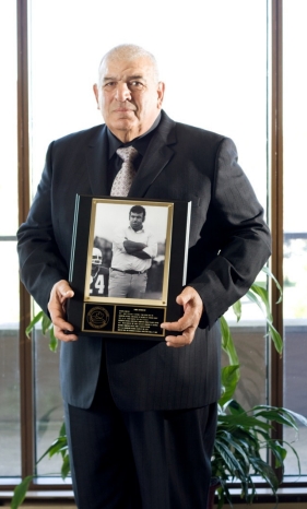 Len Monico posing with his plaque for Sports Hall of Fame