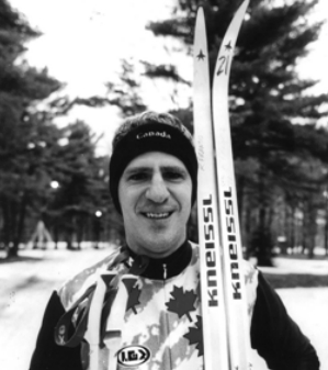 Richard Francis posing with his skiis