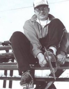 Art Jennings sitting down, putting on his skates