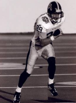 Andrew Grigg running on the football field