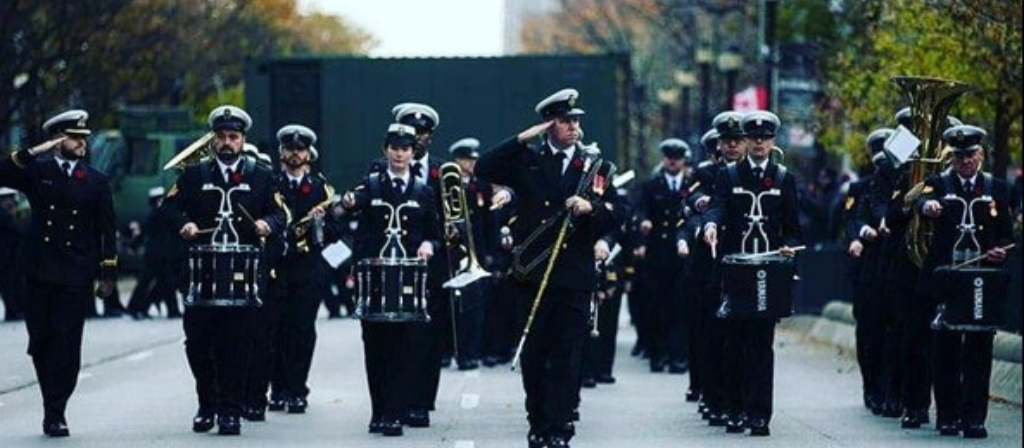 Navy band of HMCS performs as the march down the street at Wolf Fest