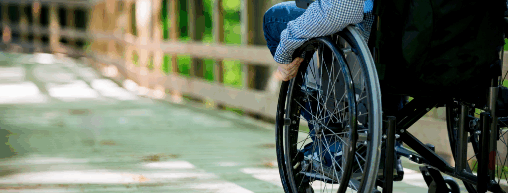 Photo of person in a wheelchair on hub trail